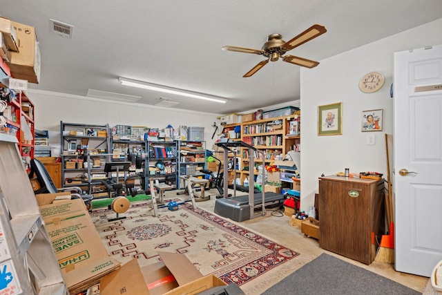 garage with a ceiling fan and visible vents