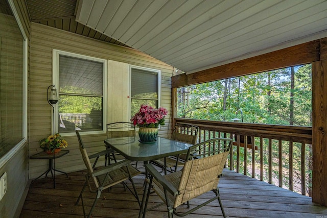 wooden terrace with outdoor dining space