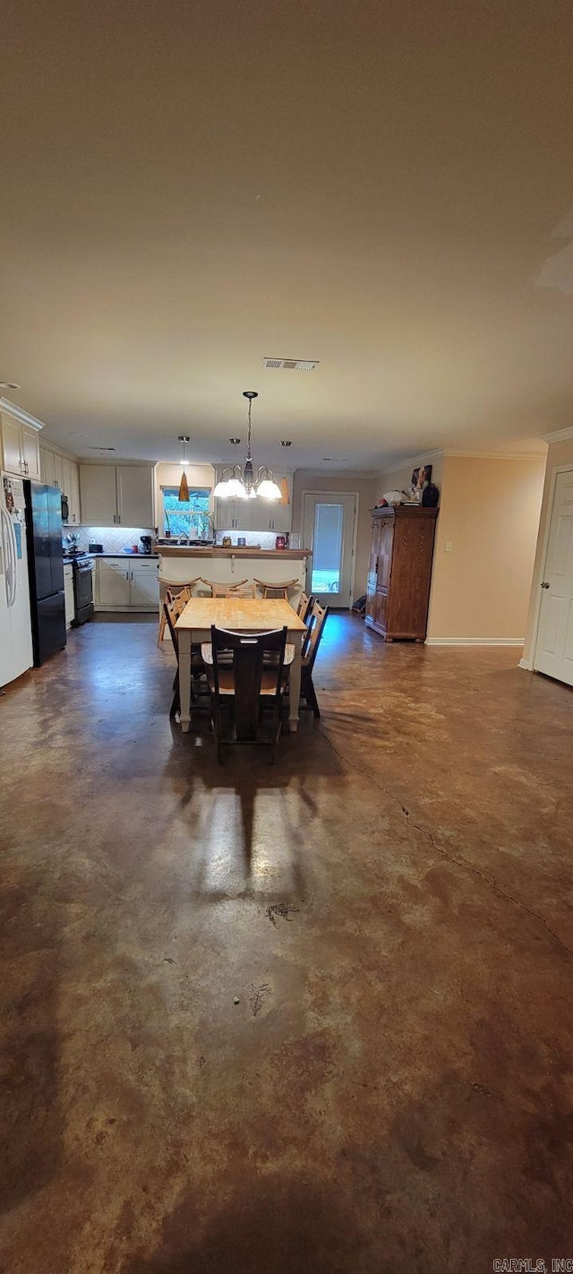 dining area featuring a notable chandelier