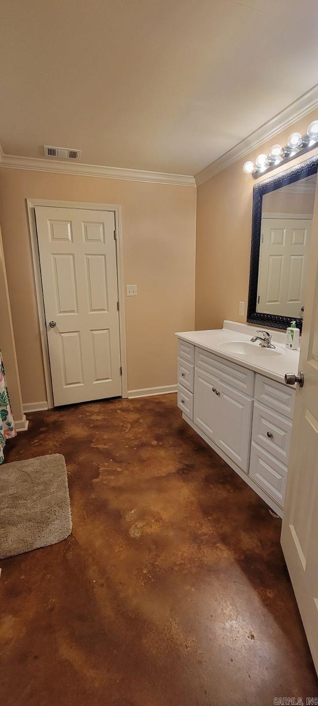 bathroom with ornamental molding, vanity, and concrete flooring