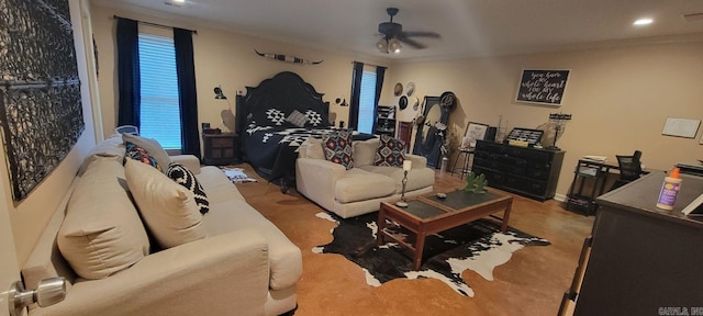 carpeted living room featuring ornamental molding and ceiling fan