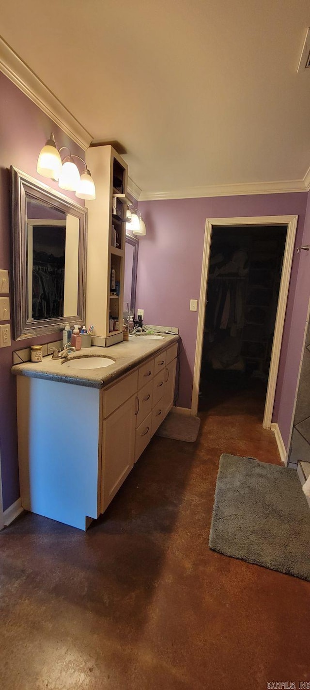 bathroom with crown molding and vanity