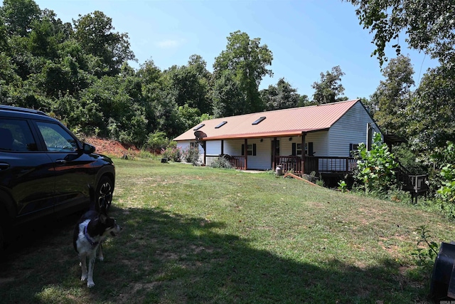 view of yard featuring covered porch