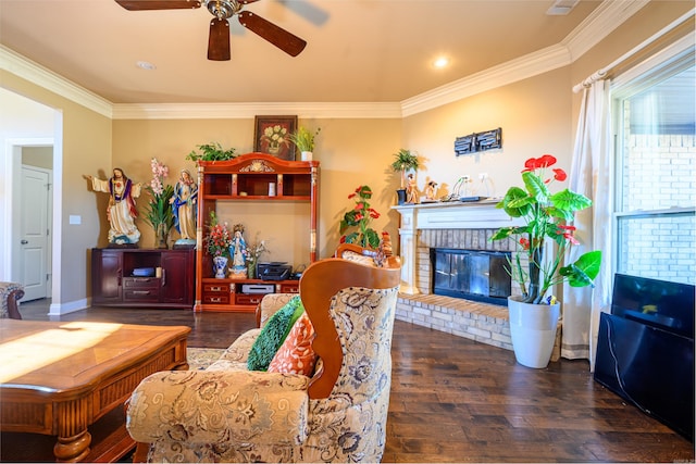 living room with a fireplace, ceiling fan, dark hardwood / wood-style flooring, and ornamental molding