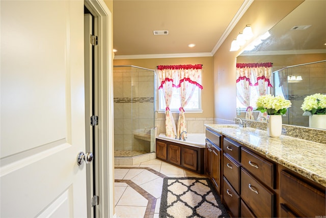 bathroom with tile patterned floors, independent shower and bath, vanity, and ornamental molding