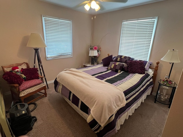 bedroom with ceiling fan and carpet flooring