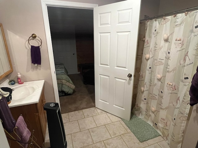 bathroom with tile patterned flooring, vanity, and a shower with shower curtain