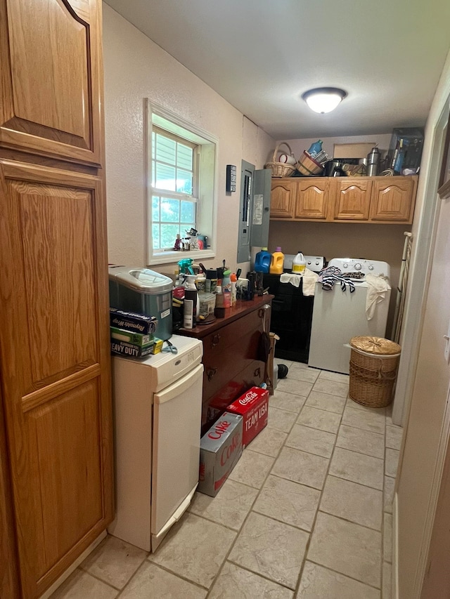 kitchen with light tile patterned floors, washer / clothes dryer, and electric panel