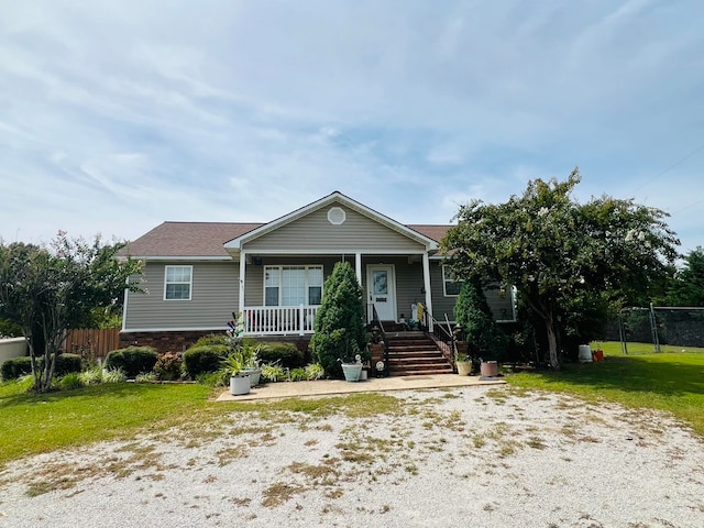 view of front of house featuring a front lawn and a porch