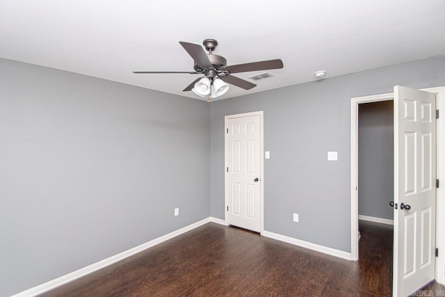 spare room with ceiling fan and wood-type flooring