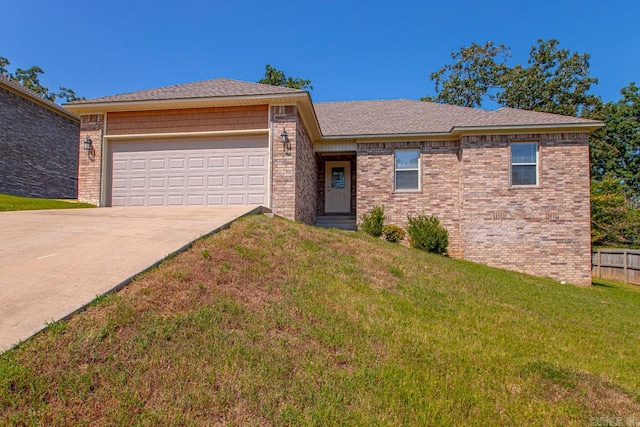 view of front facade with a front lawn and a garage