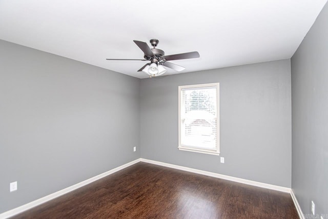 unfurnished room with ceiling fan and hardwood / wood-style flooring