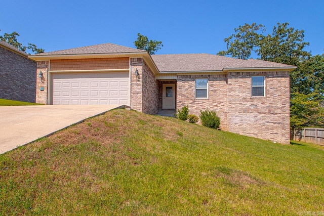 view of front of home with a garage and a front yard