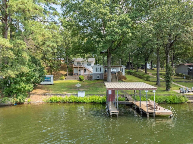 dock area with a deck with water view and a lawn