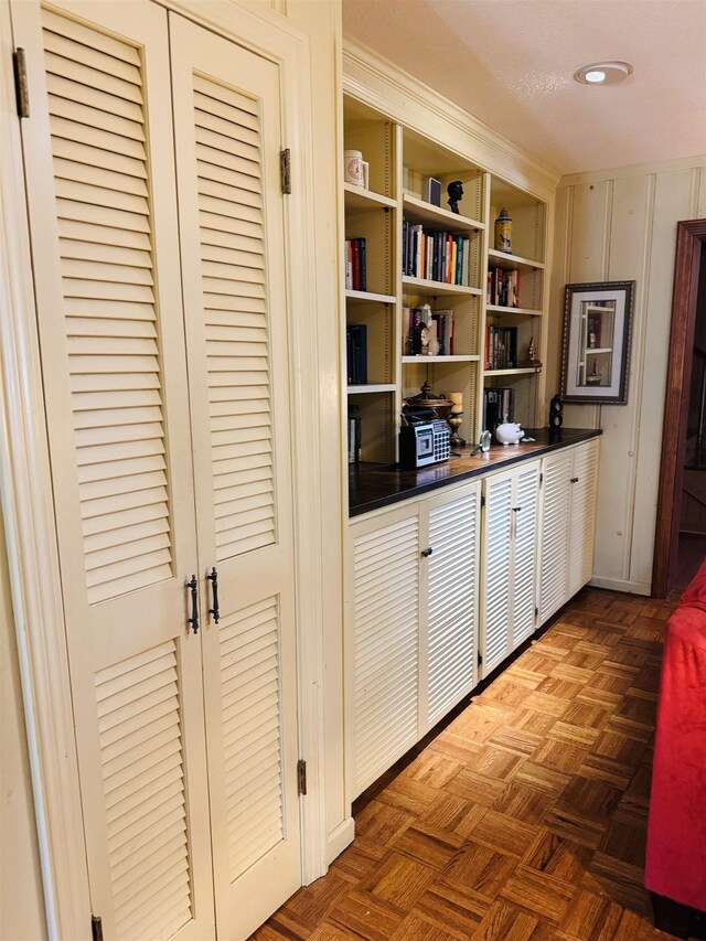 hallway with dark parquet floors