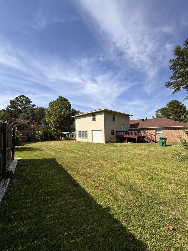 view of yard featuring a wooden deck