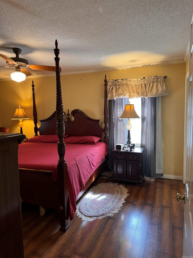 bathroom featuring toilet, a textured ceiling, vanity, and ornamental molding