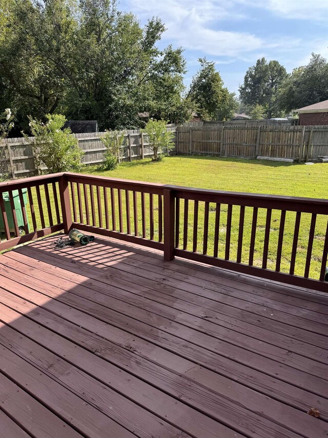 wooden terrace with a yard