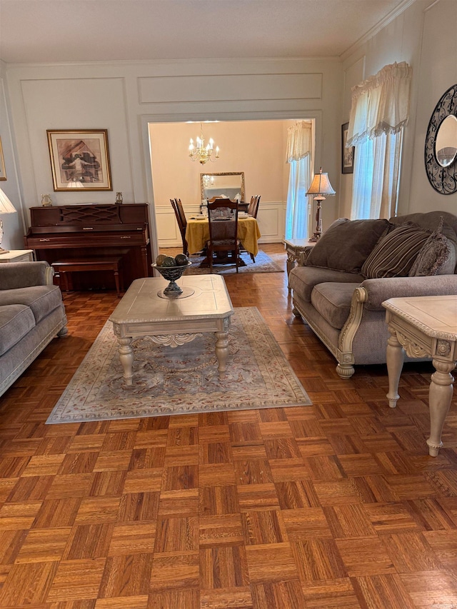 living room featuring a notable chandelier and dark parquet floors