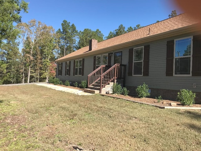 single story home with a front yard