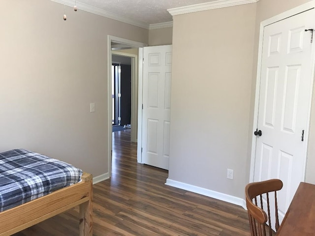 bedroom featuring crown molding and dark hardwood / wood-style floors