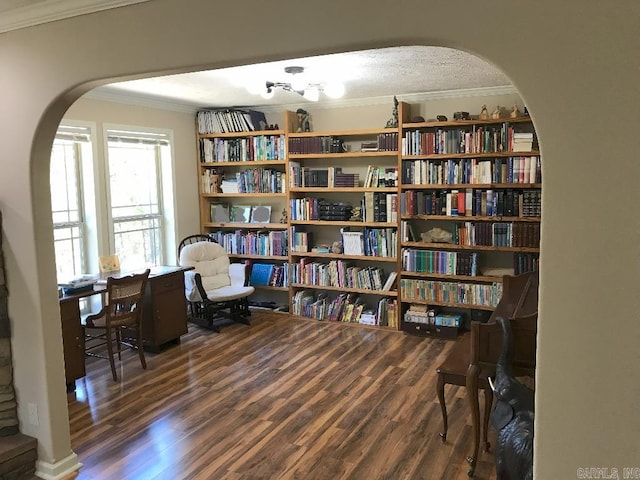 sitting room featuring ornamental molding and dark hardwood / wood-style flooring