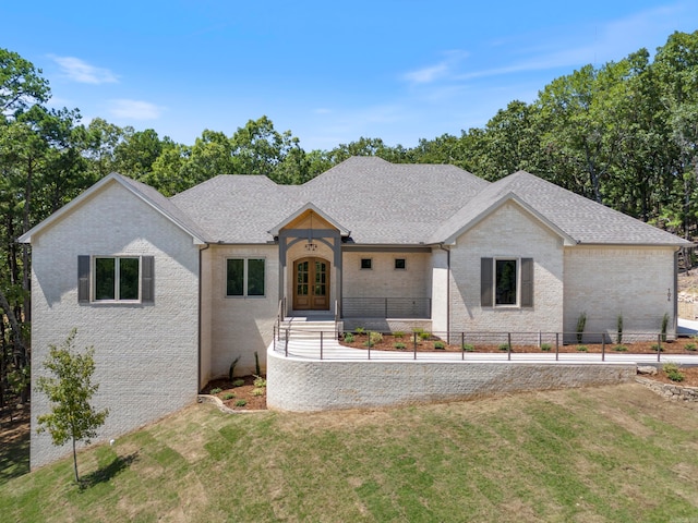 ranch-style home with a front lawn