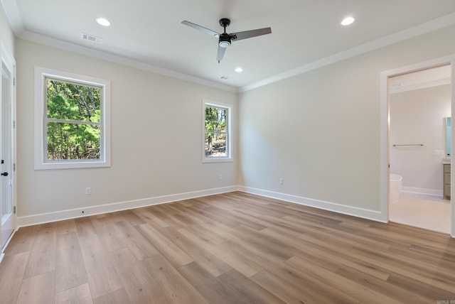 unfurnished room featuring ceiling fan, crown molding, light hardwood / wood-style floors, and a healthy amount of sunlight