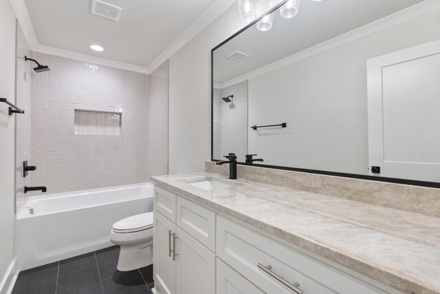 full bathroom with crown molding, tiled shower / bath, toilet, and vanity