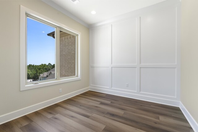 spare room with hardwood / wood-style floors