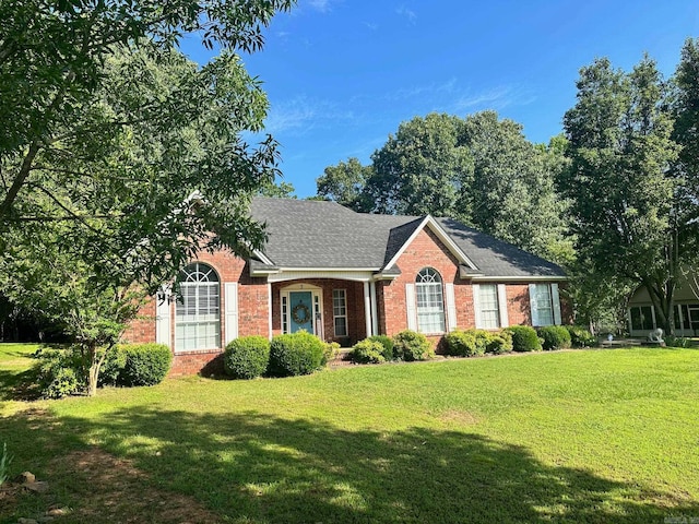 single story home featuring a front yard