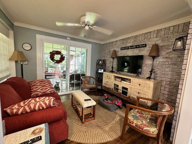 living room featuring ceiling fan, hardwood / wood-style flooring, and ornamental molding