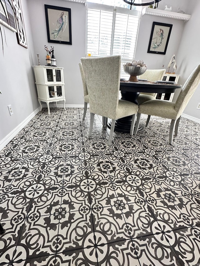 dining space featuring tile patterned floors