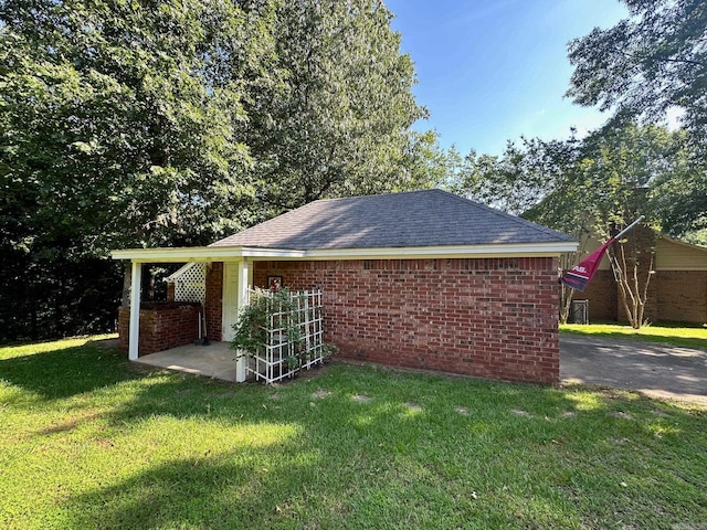 view of property exterior featuring a lawn