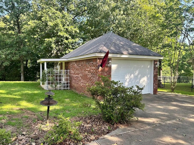 garage featuring a lawn