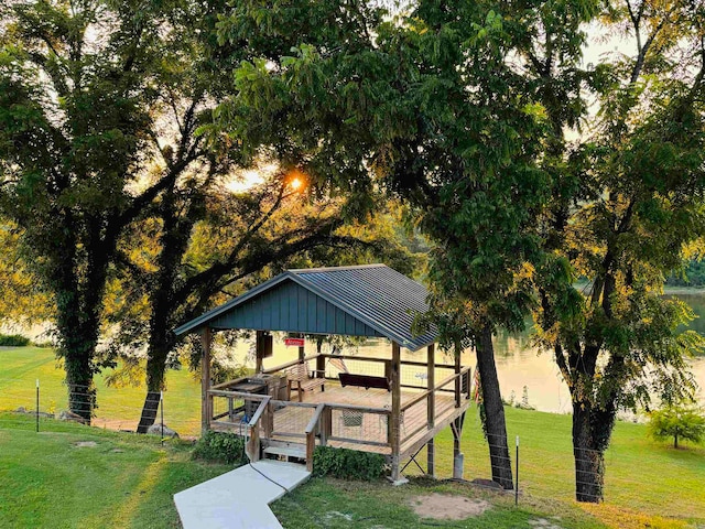 view of property's community featuring a lawn and a gazebo