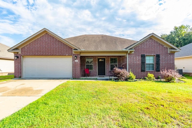 ranch-style home with a garage, a front lawn, and central AC unit