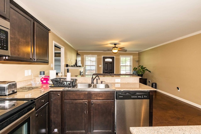 1107 Fox Chase Dr, Bryant, AR 72022 - kitchen featuring crown molding, stainless steel appliances, a sink, and a peninsula