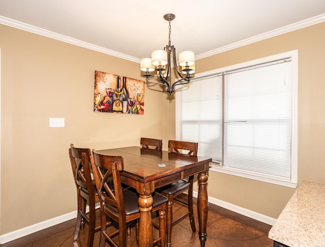 dining area with crown molding, an inviting chandelier, and dark tile patterned flooring