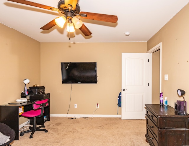 carpeted home office with ceiling fan