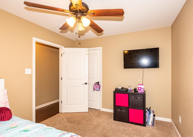 carpeted bedroom with ceiling fan