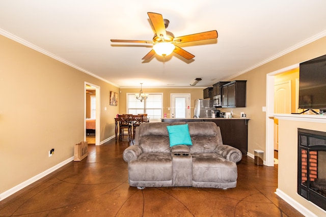 living room featuring crown molding and ceiling fan with notable chandelier