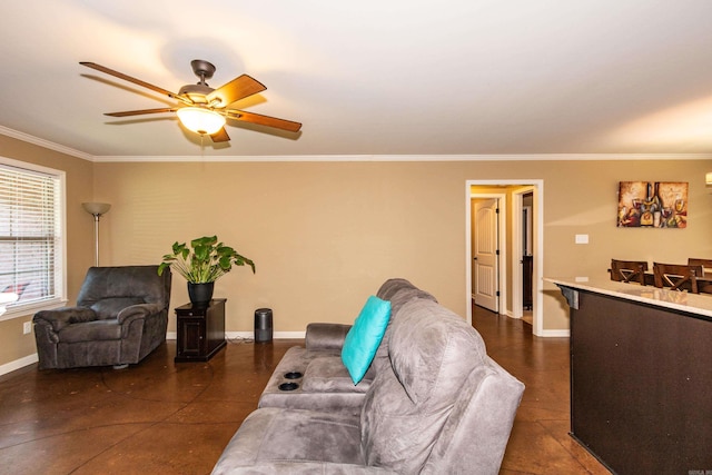 living room with ceiling fan and crown molding