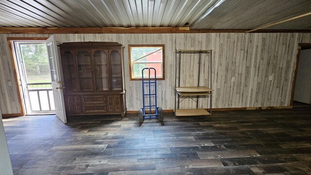 entrance foyer featuring beam ceiling and dark hardwood / wood-style floors