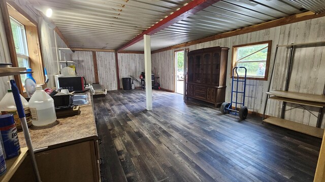 interior space with plenty of natural light and dark hardwood / wood-style flooring