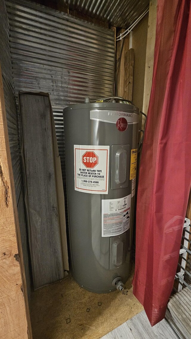 utility room featuring water heater