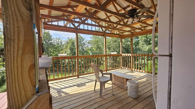 wooden deck featuring ceiling fan