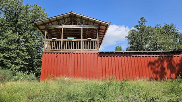 view of property exterior with metal roof