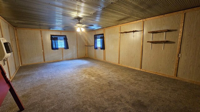 unfurnished bedroom with wood walls, a closet, light carpet, and wood ceiling