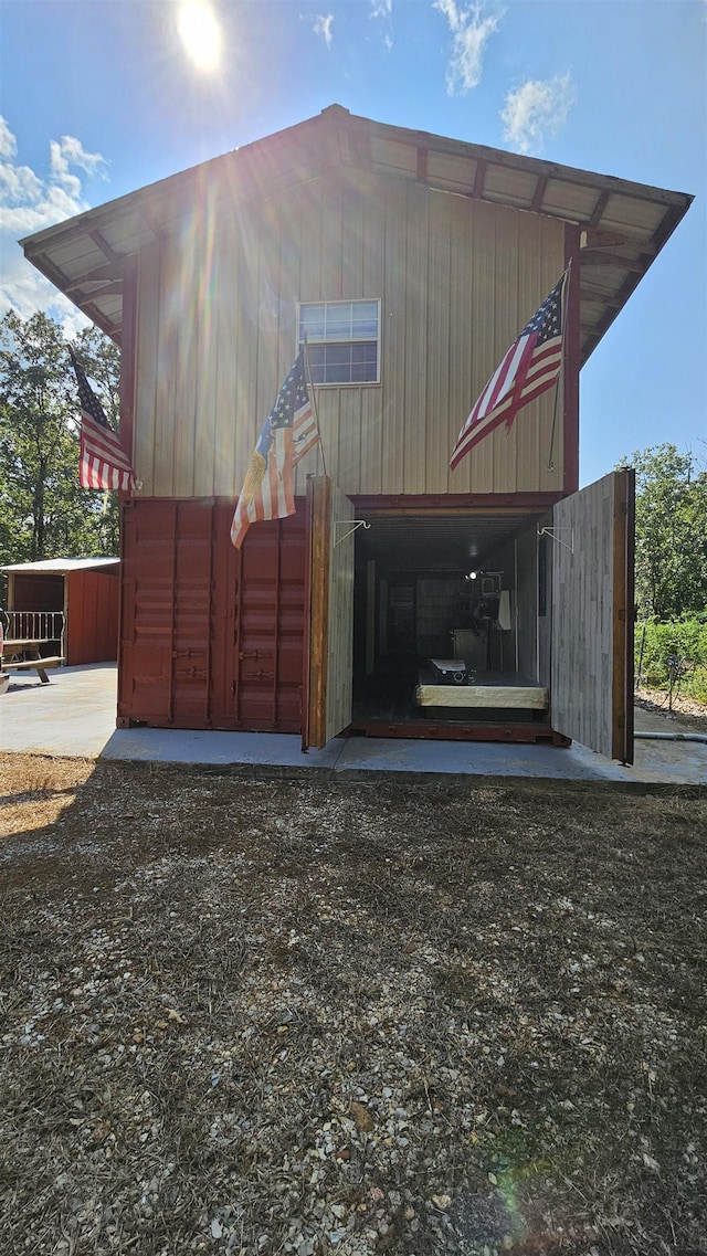 exterior space with a pole building and an outdoor structure